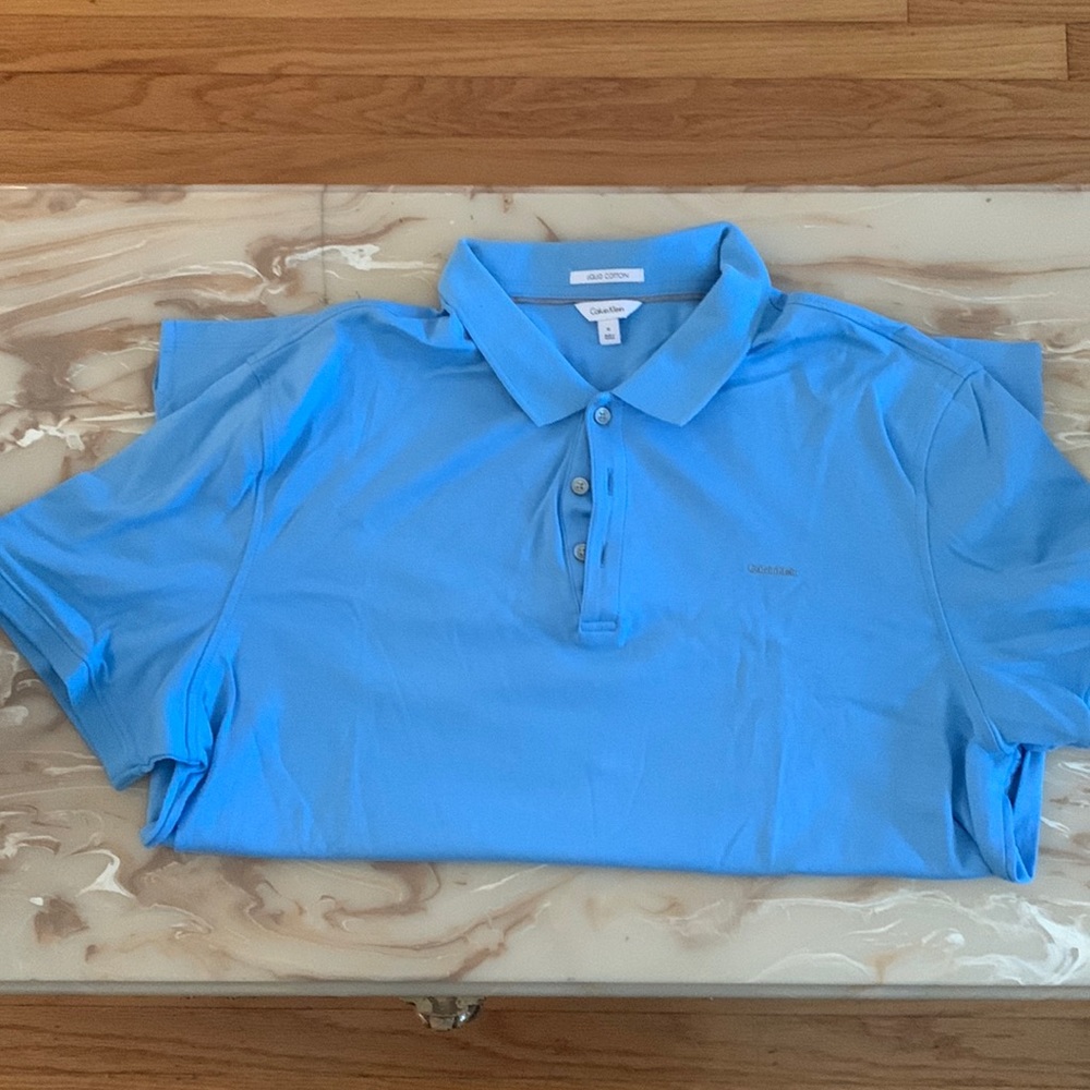 Men’s Calvin Klein polo shirt light blue XL.  Like new